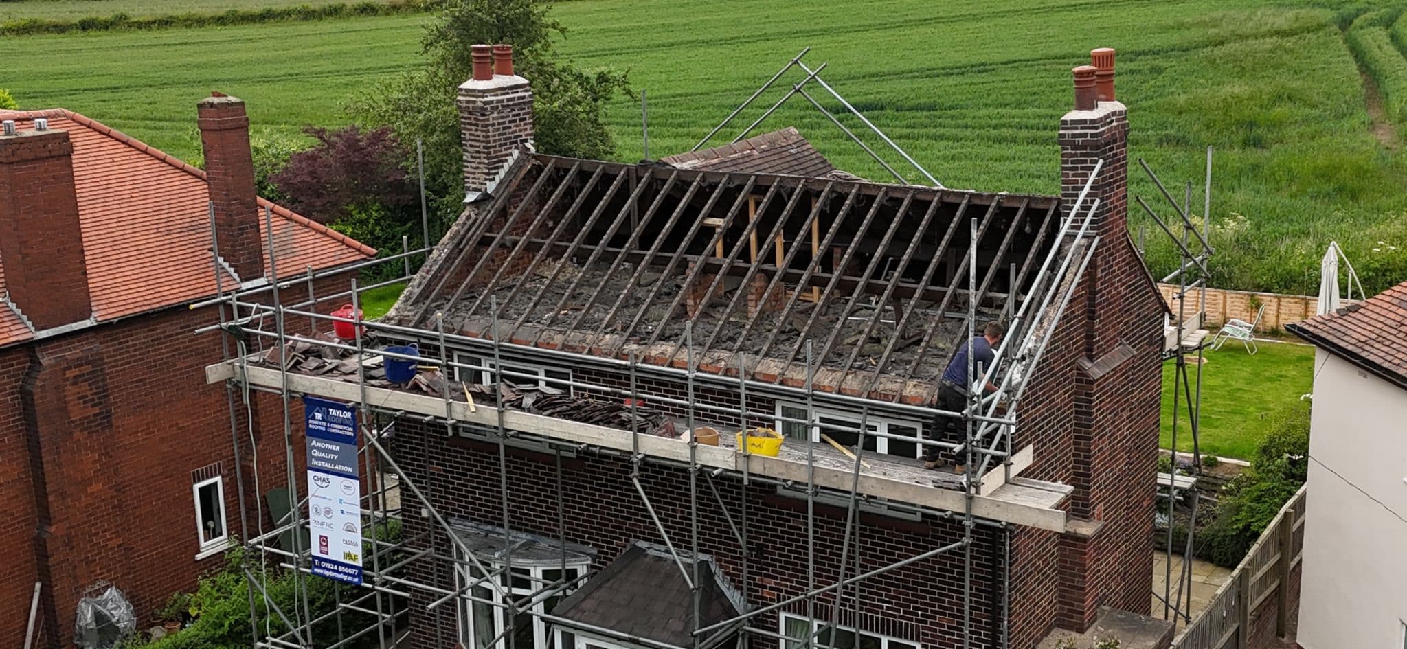Newly installed tiled roof on a detached house