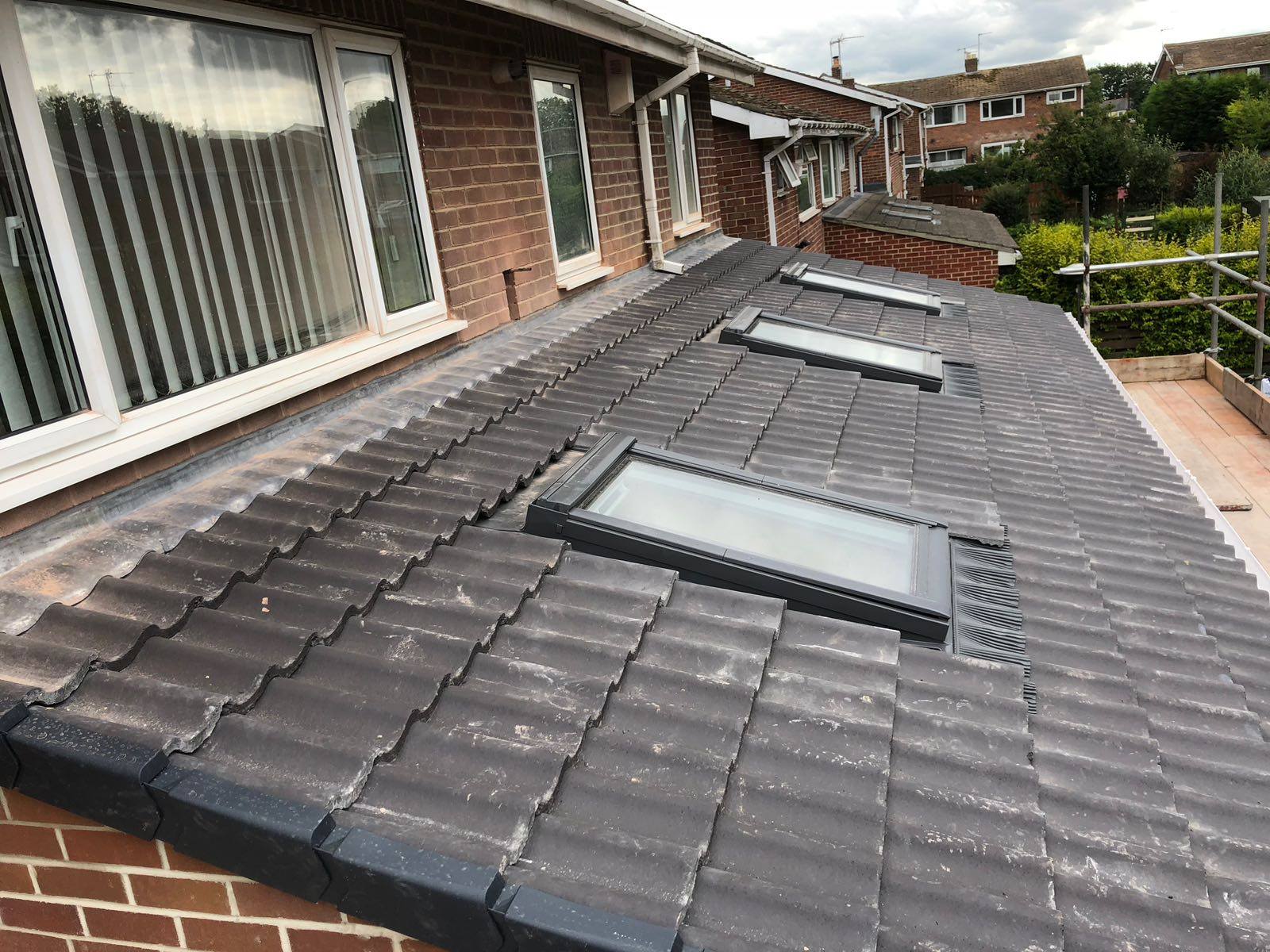 Storm damage roof repair in progress